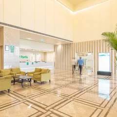 The Fortis Hospital in Greater Noida showcases a successful hotel-to-hospital conversion. The grand lobby, a remnant of its past, is reimagined as a welcoming, spacious reception area, demonstrating how hospitality-driven design can enhance the patient experience in a clinical setting.