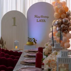 A minimalist and elegant first birthday dinner. The clean lines, soft lighting, and carefully chosen decor create a sophisticated yet warm celebration.