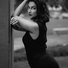 A black and white version of a pose from the same shoot, emphasizing emotion, form, and contrast. Monochrome images add a timeless and artistic touch to any portfolio.