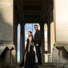 A powerful, dramatic shot from their London pre-wedding shoot. The all-black, formal outfits we chose created a sense of timeless elegance against the classic architecture.