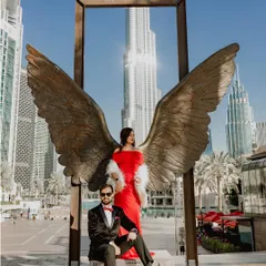 For this glamorous pre-wedding shoot in Dubai, I framed the couple against the iconic Burj Khalifa with the famous angel wings sculpture. This shot combines modern architecture with a touch of fantasy, showcasing a luxurious and stylish pre-wedding experience.