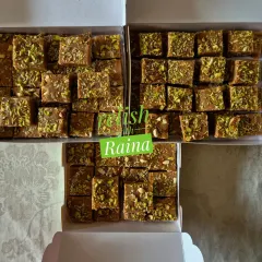 Three boxes of Adadiya Pak, a traditional Gujarati winter sweet. It's made with urad flour, ghee, dry fruits, and special adadiya masala to give warmth to the body during cold weather.