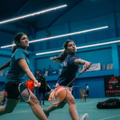 A women's doubles team in perfect sync, moving together to cover the court. Our events are a great platform for showcasing teamwork and coordination.