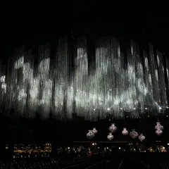 For a grand sangeet night, we created a breathtaking canopy of shimmering crystal tassels. This design shows how we use light and technology to craft an atmosphere of pure, understated elegance.
