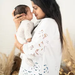 The special bond between a mother and her child, captured in a simple, loving gaze. These are the quiet moments that hold so much meaning.