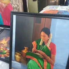 A framed oil painting I exhibited at the Chithra Santhe art market in Bangalore. This piece captures a quiet moment of a woman stringing flowers, focusing on the rich colors of her saree and the warm light.