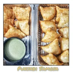 Classic Punjabi Samosas, perfectly spiced and fried until golden brown, served with my homemade green chutney.