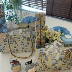 Another view of our blue-themed baby boy hampers. The image highlights the patterned gift totes with sturdy rope handles, filled with a mix of essentials and decorative items.
