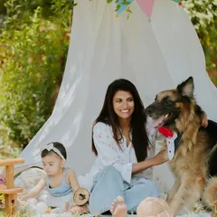 The whole family together, including their handsome dog dressed in a bow tie. This portrait is a perfect example of how I include fur babies in family sessions.