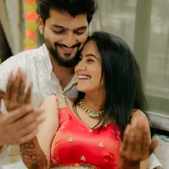 A lovely, candid moment between a couple at their mehndi function. It's a joy to be part of such happy celebrations.