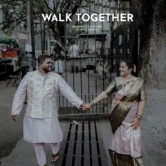 Walking together into your future. This candid shot from an engagement session captures the couple in a natural, happy moment.