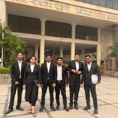 My team and I outside the District Court in Rohini. We are regulars here, handling numerous family law cases, from divorce petitions to domestic violence matters.