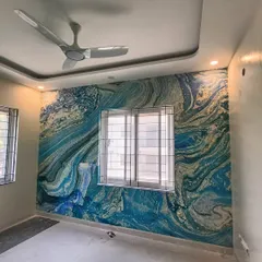 An example of a modern abstract wallpaper installation in a bedroom. The blue and gold marble-like pattern creates a dramatic and sophisticated accent wall, and I ensure the lines flow perfectly around corners.