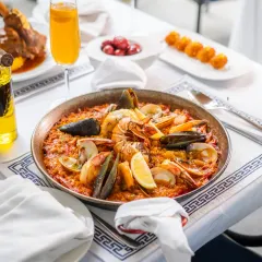 Our royal seafood paella is a taste of Valencia, made with saffron-laced rice and the freshest seafood. It’s a dish for sharing, a centerpiece for your table that tells the story of Spanish culinary tradition.