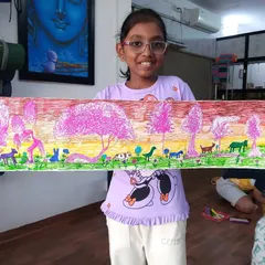 Jivika from 3rd standard created this lovely evening jungle scene. She used sketch pens to create a beautiful pink-hued sky and populate the landscape with various wild animals.