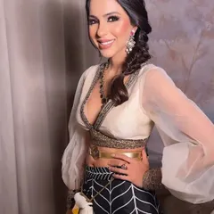 A beautiful smile to light up the intense makeup. This shows that a dramatic smokey eye doesn't have to be severe; it can be paired with a joyful expression for a look that is both strong and approachable.