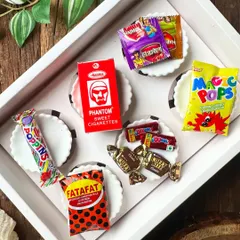 This was the inspiration for our Rakhi "Nostalgia Box". We took iconic childhood candies like Poppins, Magic Pops, and Phantom and used their flavors and colors to create a unique set of cupcakes that brought back so many fun memories.