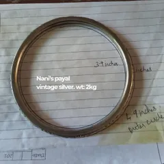 The process begins with understanding the story. This is a snapshot of a client's 'Nani's payal', a vintage silver anklet weighing 2kg, which we planned to incorporate into her wedding look, showcasing our attention to sentimental details.