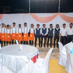 My team of waiters and service staff posing for a photo at a wedding in Panvel. I have a large team ready to handle events of any size.