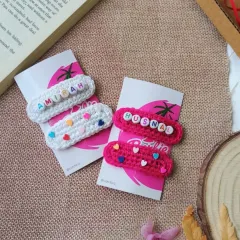 A lovely pair of custom name clips ready to be sent out. I made the white crochet clip with the name 'Amirah' and the vibrant pink one with 'Husnal' and tiny heart beads.