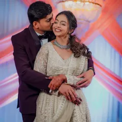 A tender moment during an engagement party in Airoli, where the groom gives his bride-to-be a gentle kiss on the cheek. The soft lighting and their happy expressions make this a cherished memory.