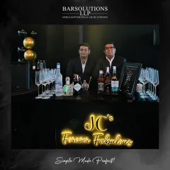 Our bartenders at a sleek, modern bar setup for a private birthday celebration, complete with custom neon signage.