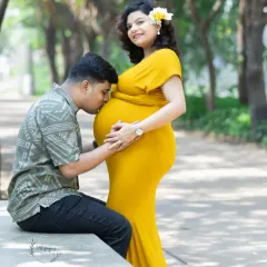 A quiet moment of connection between parents-to-be. Capturing the father's gentle kiss on the baby bump is one of the most heartwarming parts of a couple's maternity session, a memory filled with love and anticipation.