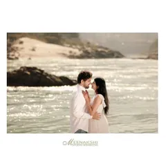 A tender pre-wedding portrait on the banks of the Ganga, with the sparkling water creating a beautiful, natural backdrop. The soft light and close embrace make this a truly romantic shot.