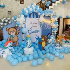 A grand 'Welcome Home' decoration to celebrate the arrival of a baby boy. This large-scale setup fills the room with a blue and white balloon sea, a custom backdrop, multiple teddy bear cutouts, and a balloon arch, creating an immersive and joyful atmosphere.