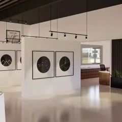 I designed the interior of this marketing office to feel like a museum. Instead of a traditional layout, I used freestanding walls to create a central display area for the company's legacy projects. This encourages clients to walk around and engage with the brand story in a dynamic way.