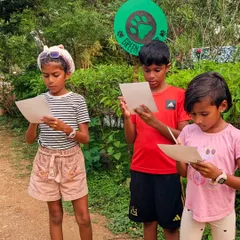 Deep in concentration. These young explorers are completely absorbed in their scavenger hunt, proving that a simple list and a park full of natural treasures can be more engaging than any screen.