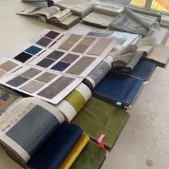 Another view of our fabric selection process for the Vishu Home project. Finding the right shade of blue velvet was key to bringing the client's vision for their dining chairs to life.