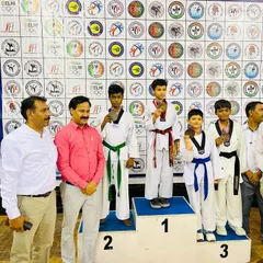 Dhairya with his silver medal at the Delhi State Championship. We celebrate every victory as a team.