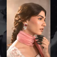 Another shot from the vintage-themed campaign. The side profile highlights the soft contour and the elegant, braided hairstyle.