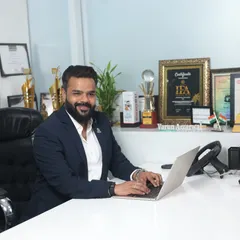A photo of me at my desk, ready to work on turning your wedding footage into a cinematic masterpiece. The awards in the background are a testament to the quality and creativity I promise to deliver.