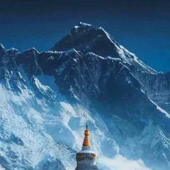 A Buddhist stupa stands against the backdrop of the mighty Himalayas on the Everest trail. The trek is a blend of natural beauty and rich Sherpa culture.