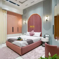 Designing for the younger members of the family is always a joy. This daughter's bedroom in Indirapuram features a stunning arched, channel-tufted headboard in rose pink, paired with soft grey walls and custom curved wardrobes, creating a space that is playful, chic, and timeless.