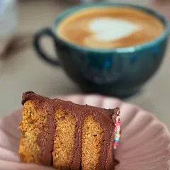 A perfect pairing of cake and coffee. This is a slice of my delicious Symphony Chocolate Cake, which has a wonderfully light texture and rich chocolate flavor.