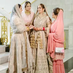 A touching moment between the bride and her family at her Sikh wedding in Bangkok.