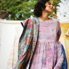 A moment of pure ease and movement. This shot for Wandering Silk shows their handcrafted apparel in a natural, sun-dappled setting, letting the soft fabric and gentle colors speak for themselves.