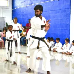 I lead a class, demonstrating a blocking technique. Teaching is an emotional connection, as we are entrusted with helping parents protect their children's futures.