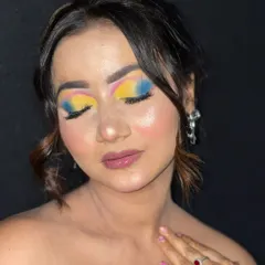 A close-up of the artistic eye makeup, highlighting the precise application and vibrant pigments.