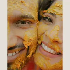 A close-up of pure happiness, with smiles that shine through the turmeric. These are the real, unfiltered moments that tell the truest story.