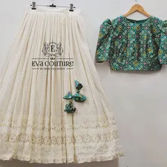 A flat-lay of the custom chikankari and printed fabric lehenga set. This design is available for both mothers and daughters, and I can customize the sizing for a perfect fit for both of you.