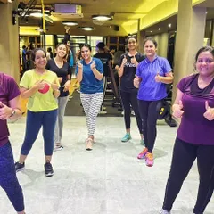 Thumbs up from the group after a great workout. The positive energy and encouragement from fellow members make every class something to look forward to.
