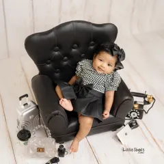 Who's the boss? This little lady, of course! Her stylish outfit, mini armchair, and cool accessories make for a fun and sassy "Boss Lady" themed sitter session.