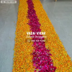 Here is a close-up view of the flower petal runner. I use fresh marigold and rose petals to create a thick, colorful carpet that makes the walk into the home feel like a truly special event.
