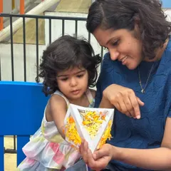 Here's a beautiful moment between a mother and child admiring a lantern they created together. My sessions often welcome parents to join in, making it a wonderful bonding experience.