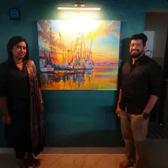 Another photo of my happy clients from Bangalore with their commissioned seascape. The painting is illuminated by a gallery light, becoming a central feature of their room.