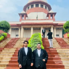 With a colleague on the steps of the Supreme Court. Our work often feels like proving our flight to a world that may not understand it, but we persist.